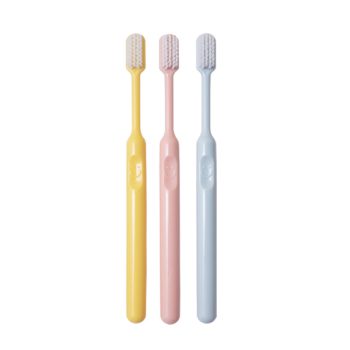 candy colored bucket shaped soft bristle small tipped toothbrush